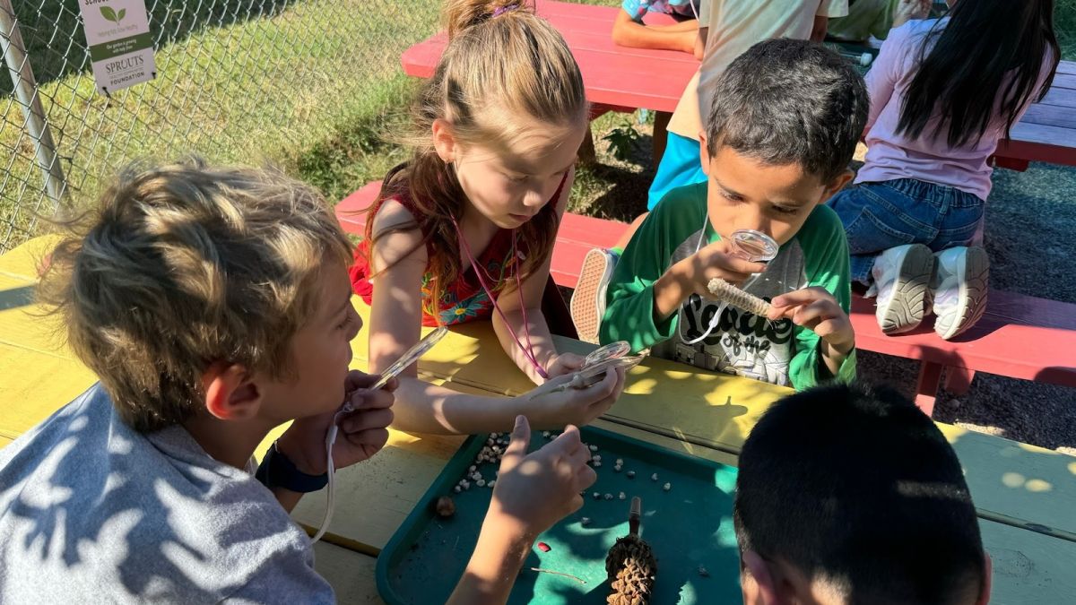 Blanton students participating in hands-on learning in the school garden